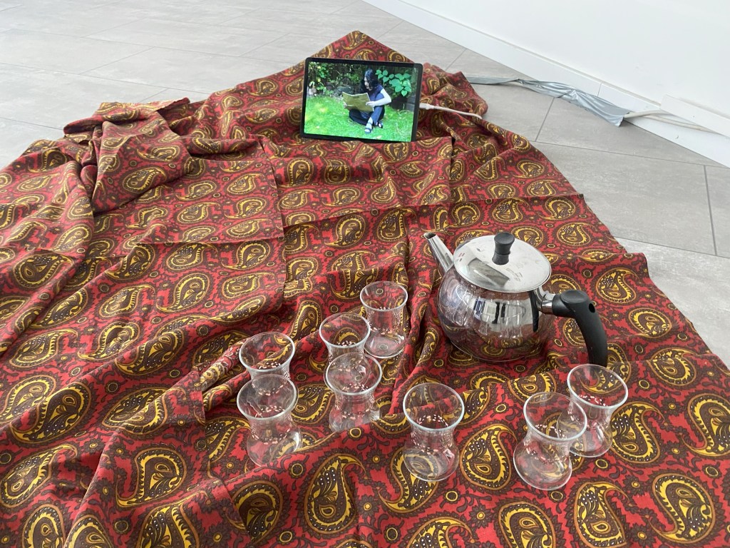 Like Bread and Water – Installation view at In The Mountains, Berlin 2025, featuring artworks displayed in a bright exhibition space.