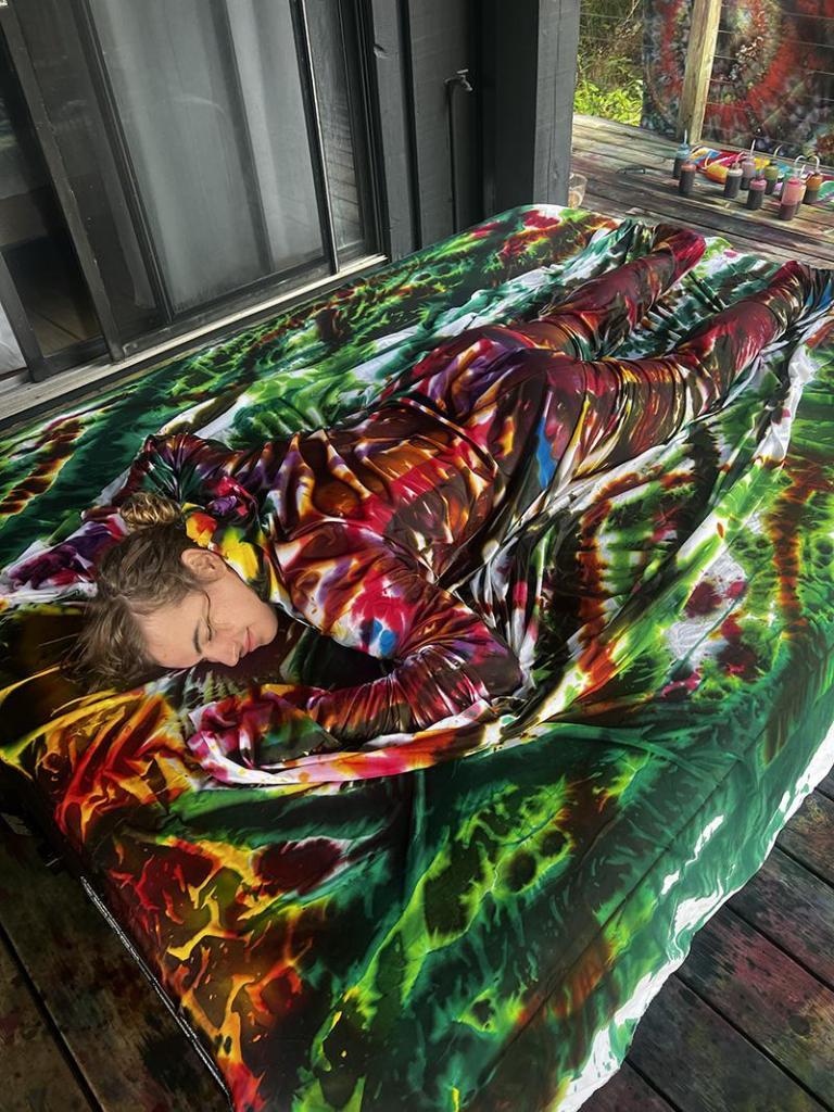 Close-up of Kyle Meyer’s process of hand-dyeing cotton fabric, showing vivid colors and textures