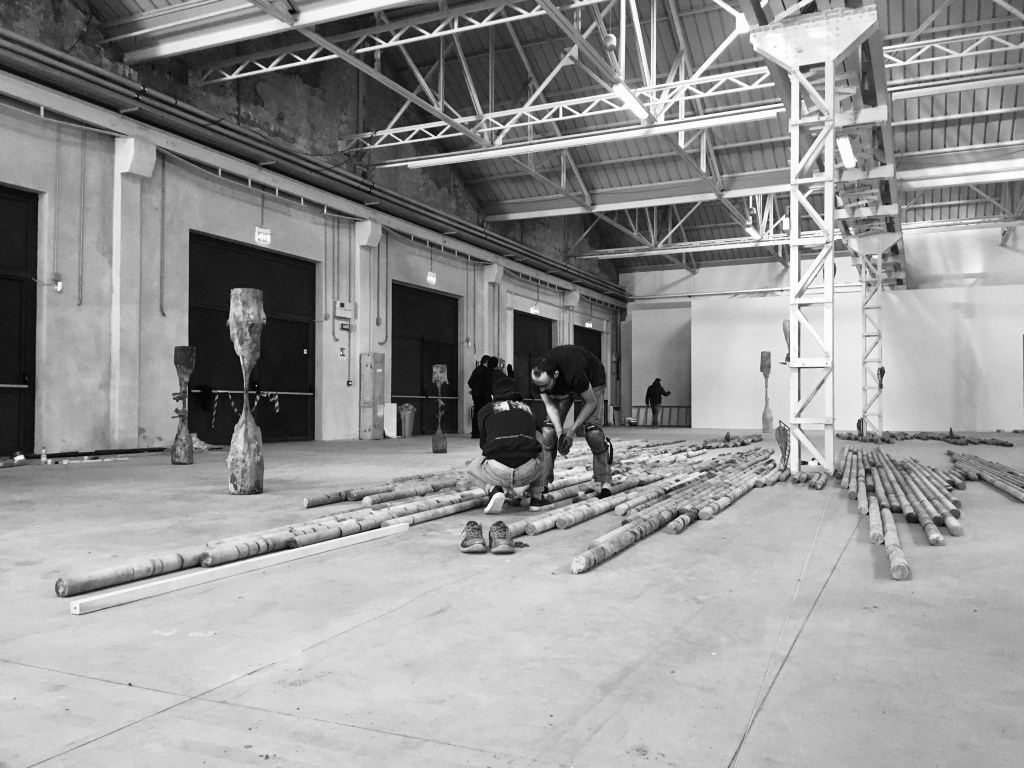 Two set-up views of CITTÀDIMILANO at Pirelli HangarBicocca, Milan, showing installation work in progress on the large-scale sculpture. Photo by Giorgio Andreotta Calò