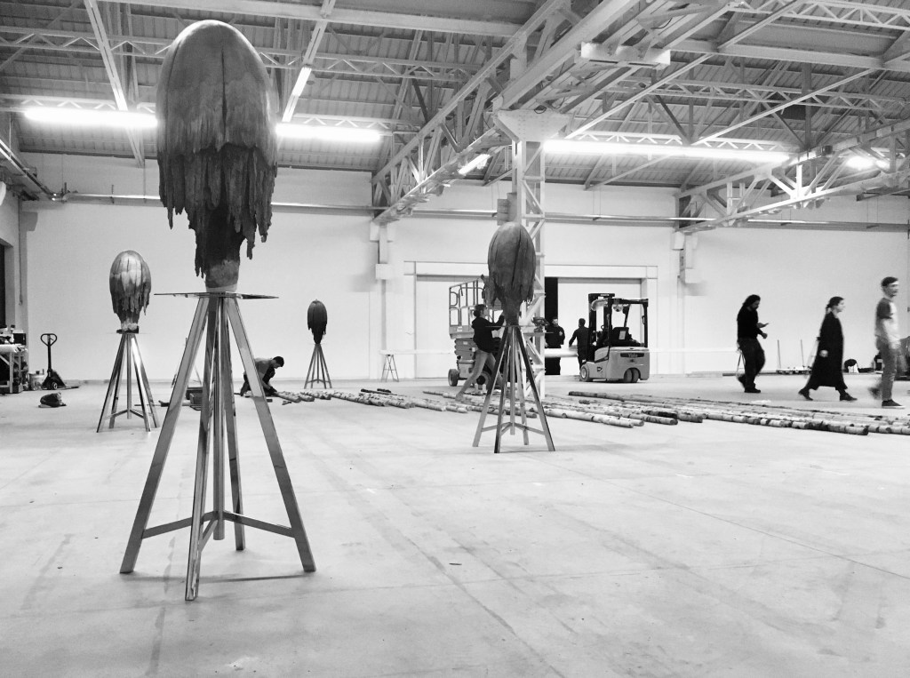 Two set-up views of CITTÀDIMILANO at Pirelli HangarBicocca, Milan, showing installation work in progress on the large-scale sculpture. Photo by Giorgio Andreotta Calò