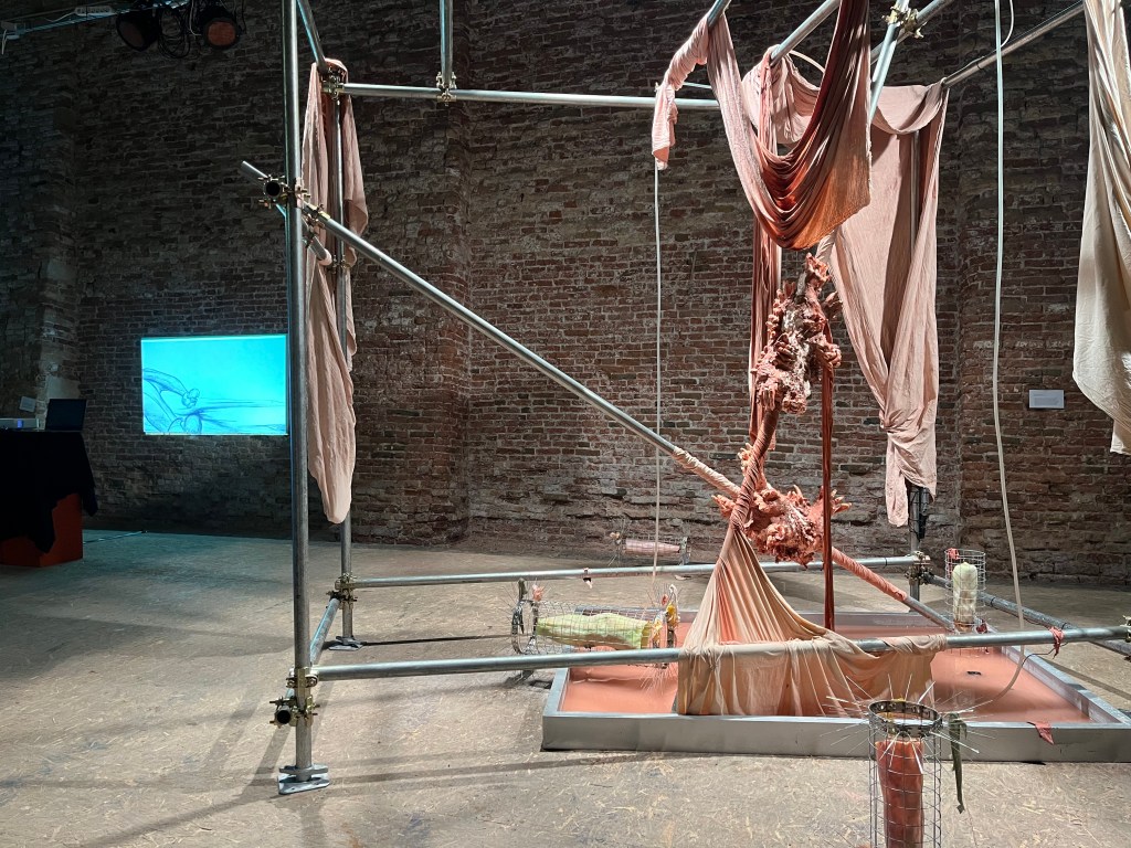 Installation view of No body makes its own bodies (2025) by Chen Chen YU at S.a.L.E. Docks, Venice, showing sculptural and spatial elements arranged within the industrial gallery space. Photo by Rebecca Canavesi