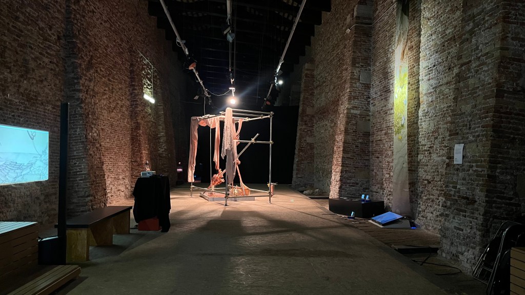 General exhibition view of Contested Waters at S.a.L.E. Docks, Venice, 2025, featuring multiple installations across the gallery. Photo by Rebecca Canavesi.