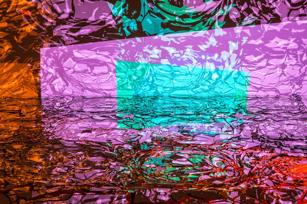 Exhibition view of On And On by Rafaël Rozendaal, where continuous digital color fields and screens interact with the industrial gallery space.