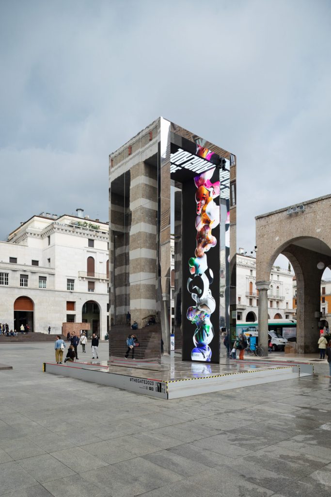 Public space installation view of Unreel – A Door to Alternative Realities at The Gate in Bergamo and Brescia, featuring digital artworks integrated into an urban setting.