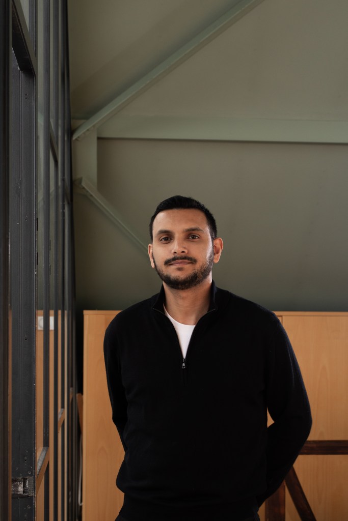 Portrait of Mohamed Almusibli, photographed by Mathilde Agius, shown in a neutral setting with a focus on his face and expression.