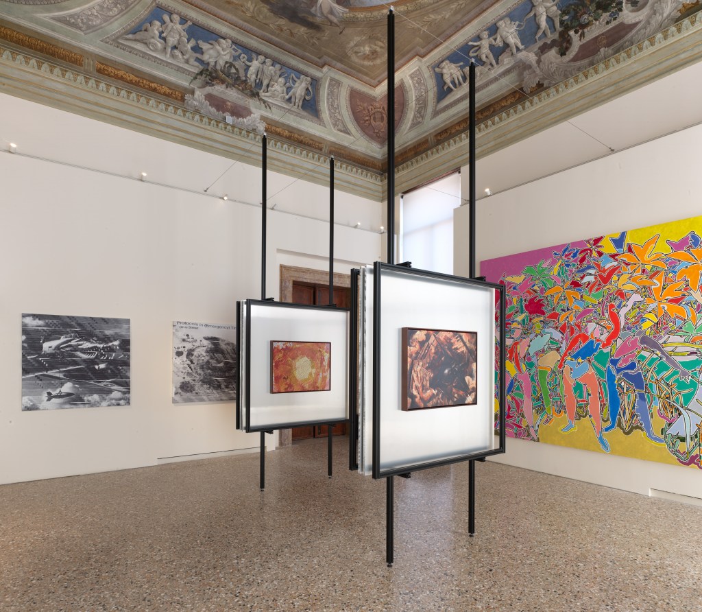 Installation view of Strange Rules at Palazzo Diedo Berggruen Arts & Culture, featuring Simon Denny with Venkatesh Rao’s Monsters Between Worlds (2026); photograph by Joan Porcel.