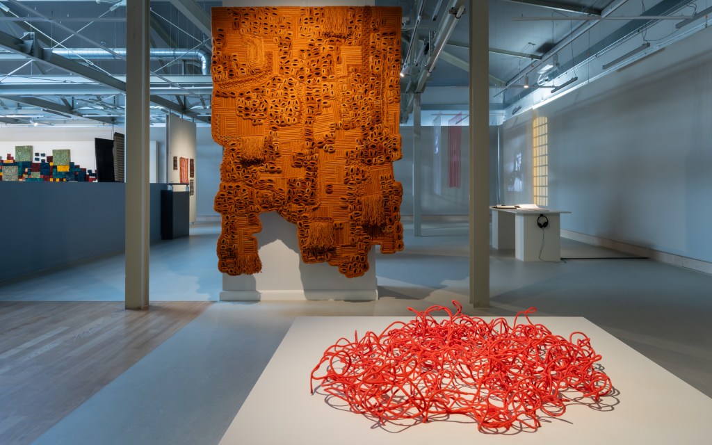 Amina Agueznay, Talisman of Henna, Variation #2 (2024), and Ngozi Ajah Schommers, Tales in Shrubs, Weeds and Gathering (2025), shown in Rhizomatic Portals: Ways of Knowing, Collateral Exhibition of the 18th International Triennial of Textile. Photo: HaWa / Courtesy of the Central Museum of Textiles in Łódź.