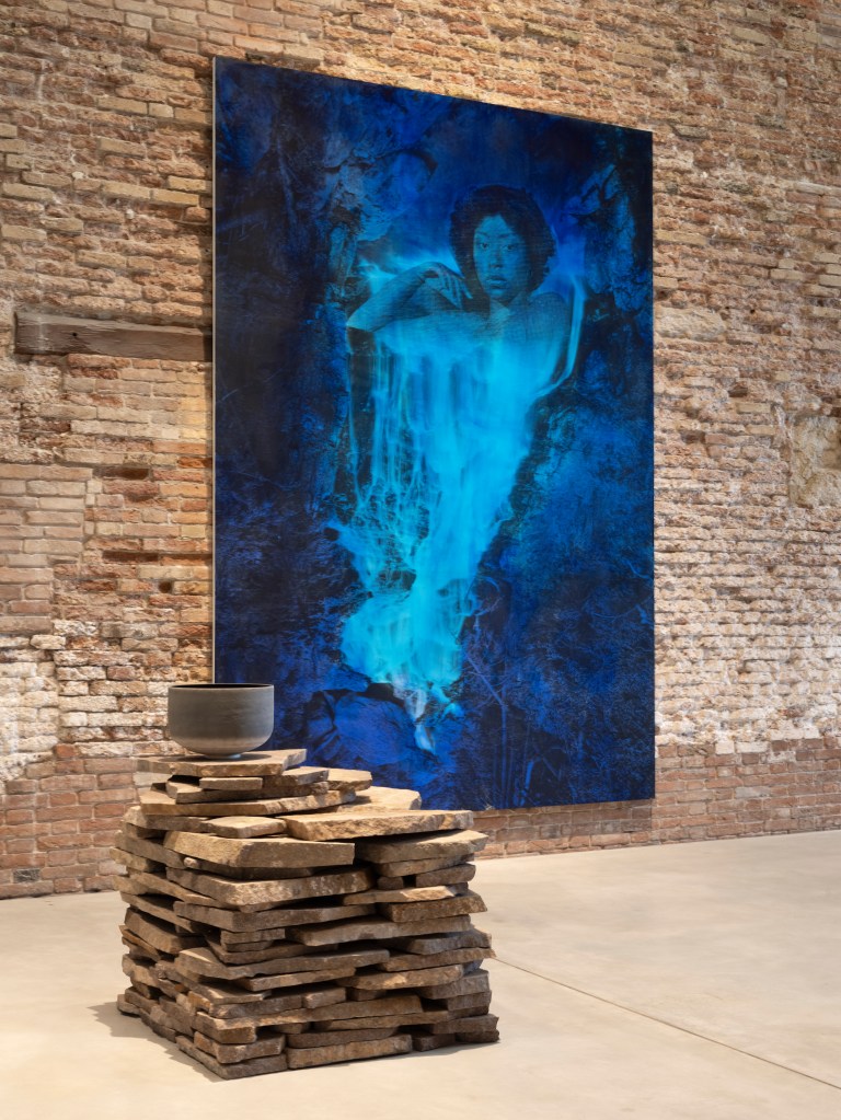 Installation view of Lorna Simpson: Third Person (2026) at Punta della Dogana, Venice, featuring Vibrating cycles (2026) on the floor and Night Fall (2023) on the wall; photograph by James Wang; courtesy of Palazzo Grassi, Pinault Collection.