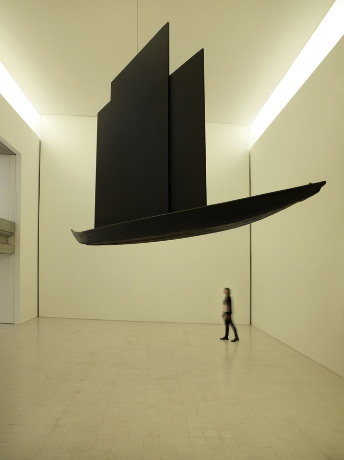 Exhibition gallery featuring an installation by Claudio Parmiggiani in the Collezione Maramotti.