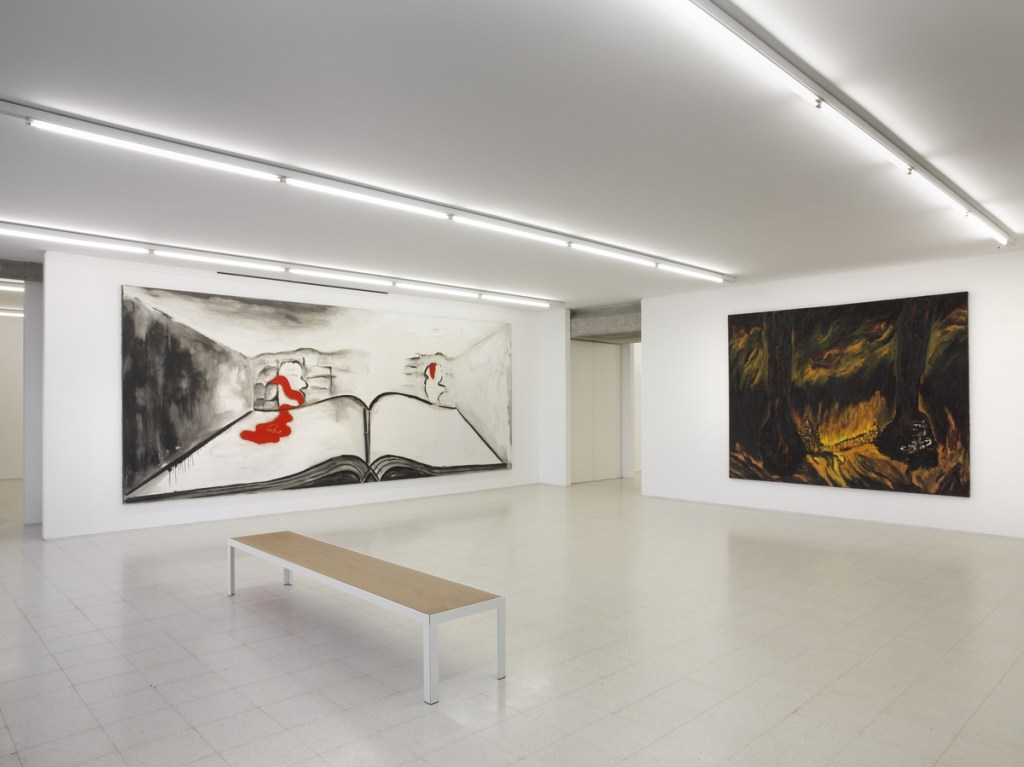 Exhibition gallery featuring artworks by Enzo Cucchi.