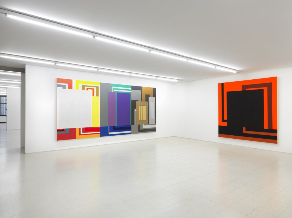 Exhibition gallery featuring artworks by Peter Halley.