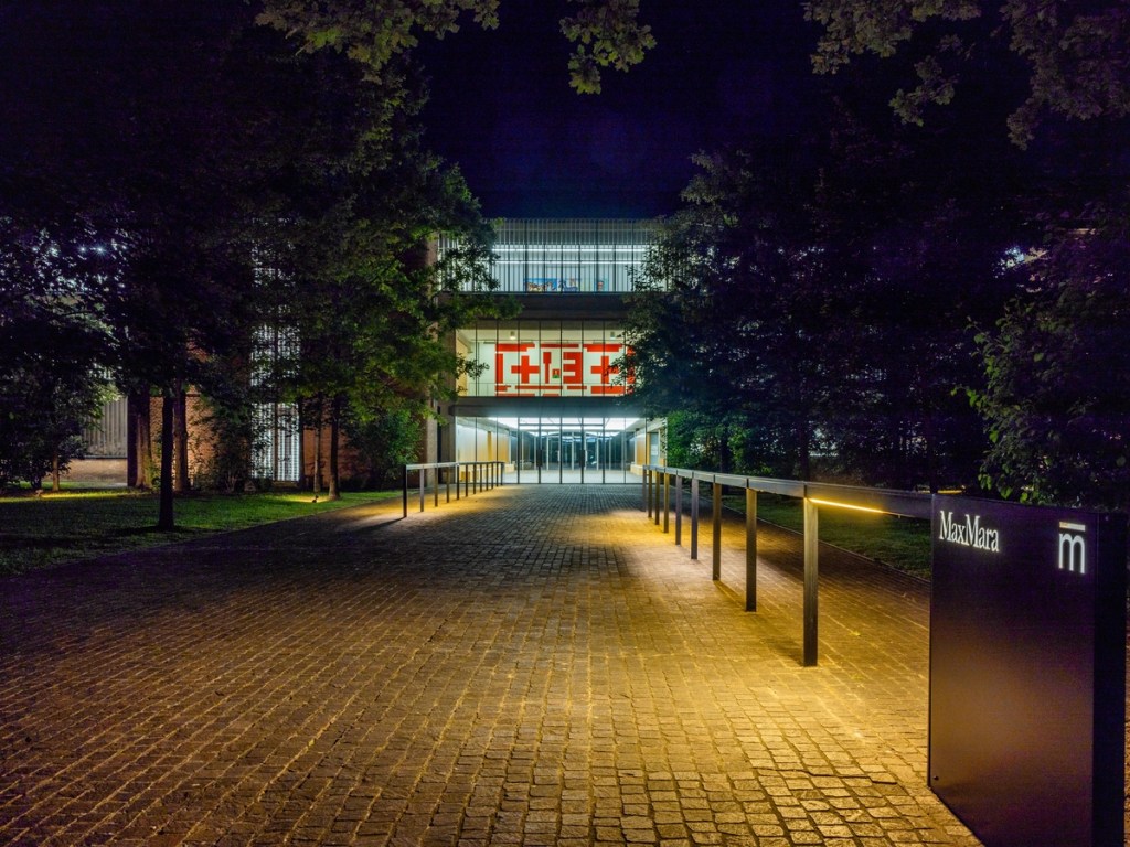 East entrance of Collezione Maramotti illuminated at night.