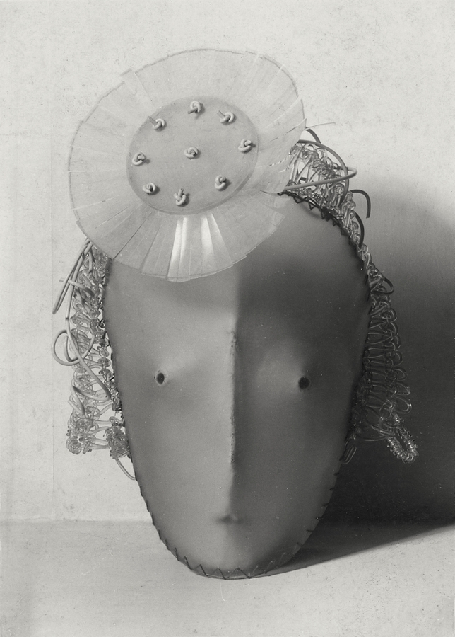 Black-and-white photograph of a sculptural mask inspired by Marlene Dietrich's face, shown from the front with stylized features and a strong sense of three-dimensional form