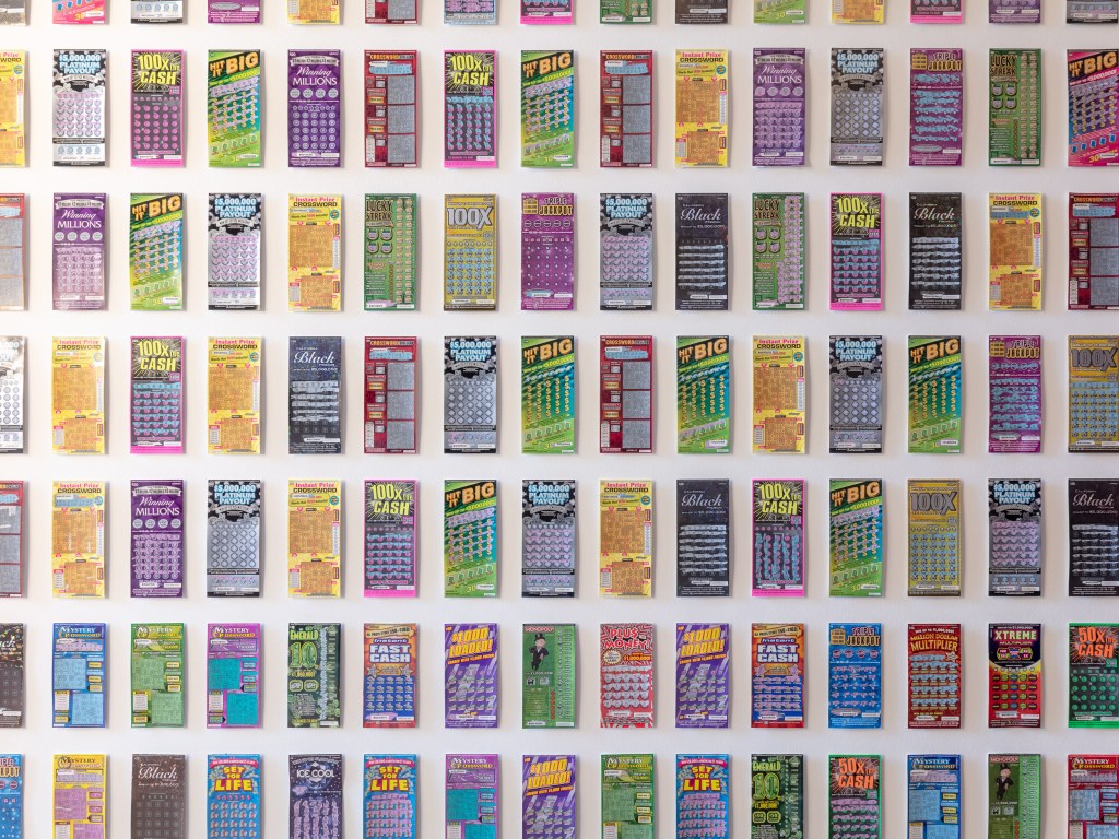 Code F63.0 Lottery Tickets (2018) by Vyacheslav Akhunov, installation view at Palazzo Franchetti. An installation incorporating lottery tickets and repeated printed elements, exploring themes of chance, obsession, and systems of value