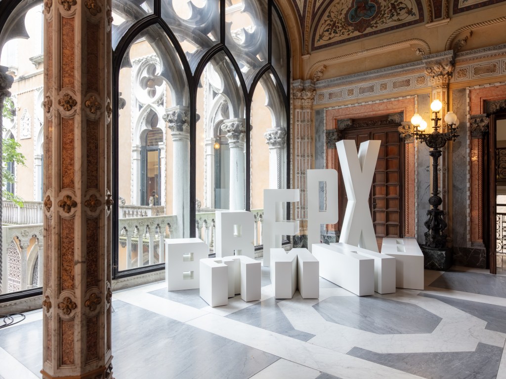 Up Down (2026) by Vyacheslav Akhunov, installation view at Palazzo Franchetti. A sculptural installation emphasizing vertical movement and spatial contrast through suspended or stacked forms.