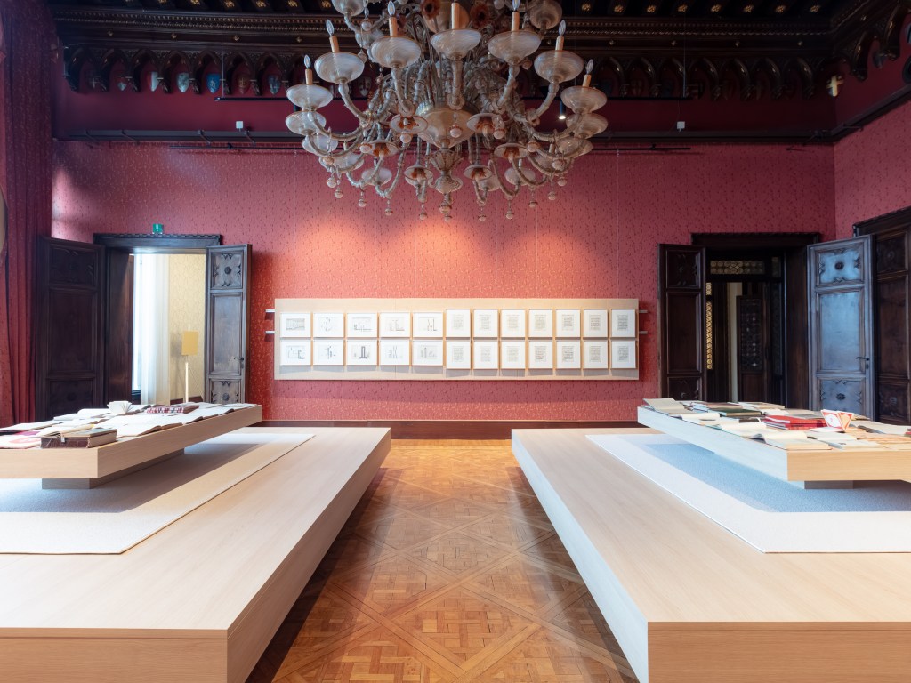 Library by Vyacheslav Akhunov. An installation composed of books and archival materials arranged to evoke a library, reflecting on memory, knowledge, and cultural history