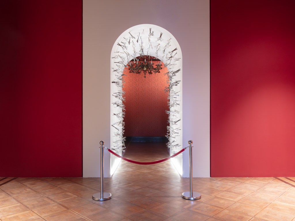 Triumphal Arch (1979/2026) by Vyacheslav Akhunov, installation view at Palazzo Franchetti. A large-scale installation featuring an arch-like structure that reimagines monumental Soviet architecture within a contemporary exhibition space