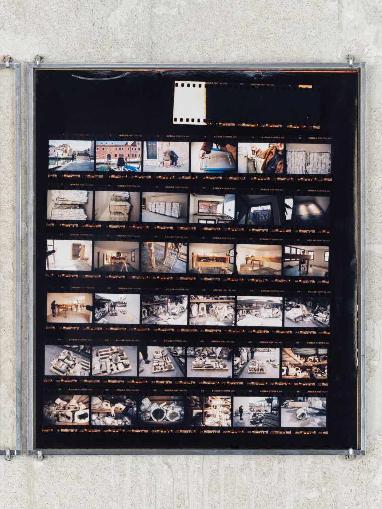 324 Photos: Hundreds of small photographs arranged in a dense grid, documenting locations across Venice and nearby islands, creating a visual archive of places and everyday scenes