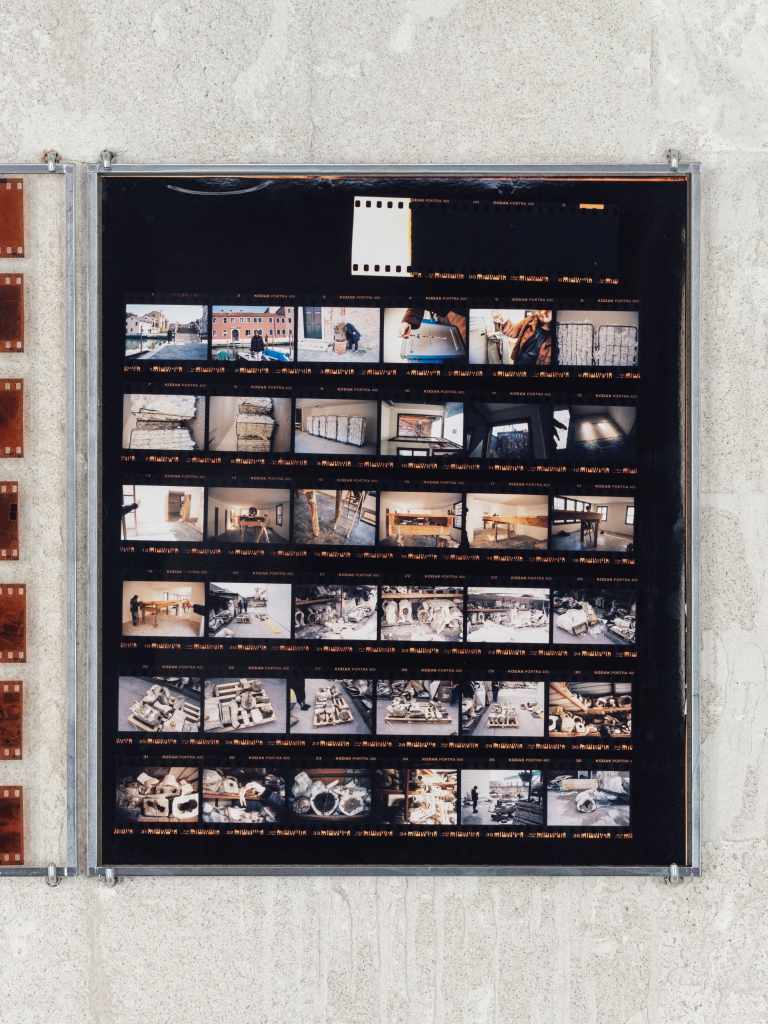 324 Photos: Hundreds of small photographs arranged in a dense grid, documenting locations across Venice and nearby islands, creating a visual archive of places and everyday scenes