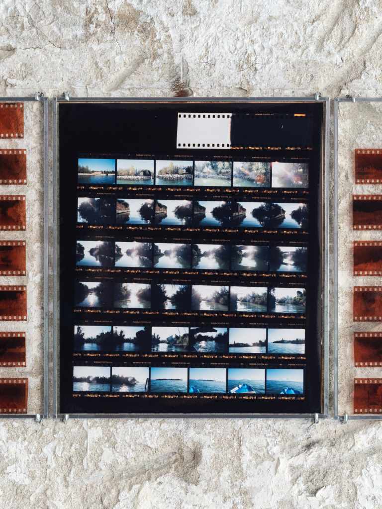 324 Photos: Hundreds of small photographs arranged in a dense grid, documenting locations across Venice and nearby islands, creating a visual archive of places and everyday scenes