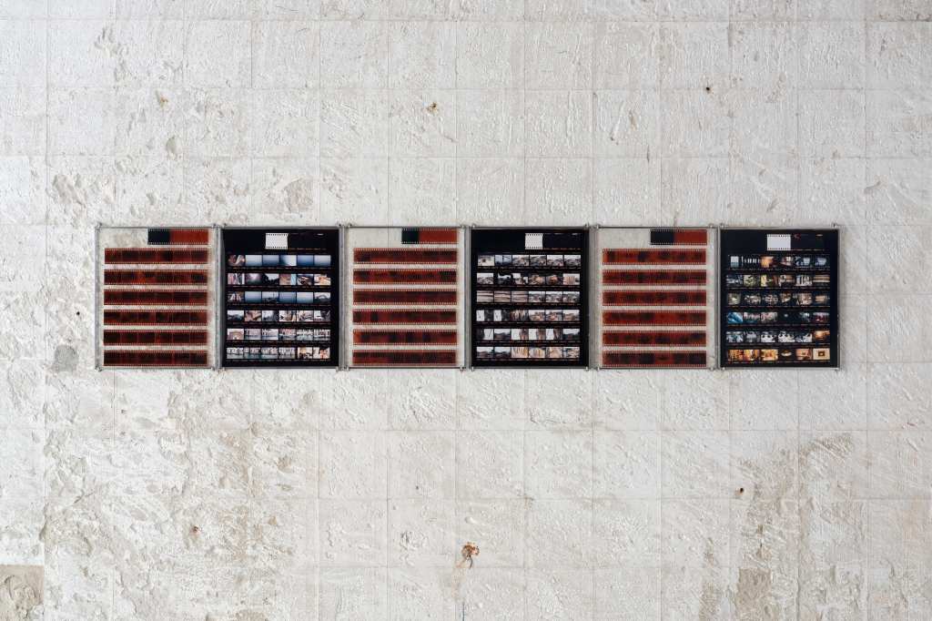 324 Photos: Hundreds of small photographs arranged in a dense grid, documenting locations across Venice and nearby islands, creating a visual archive of places and everyday scenes