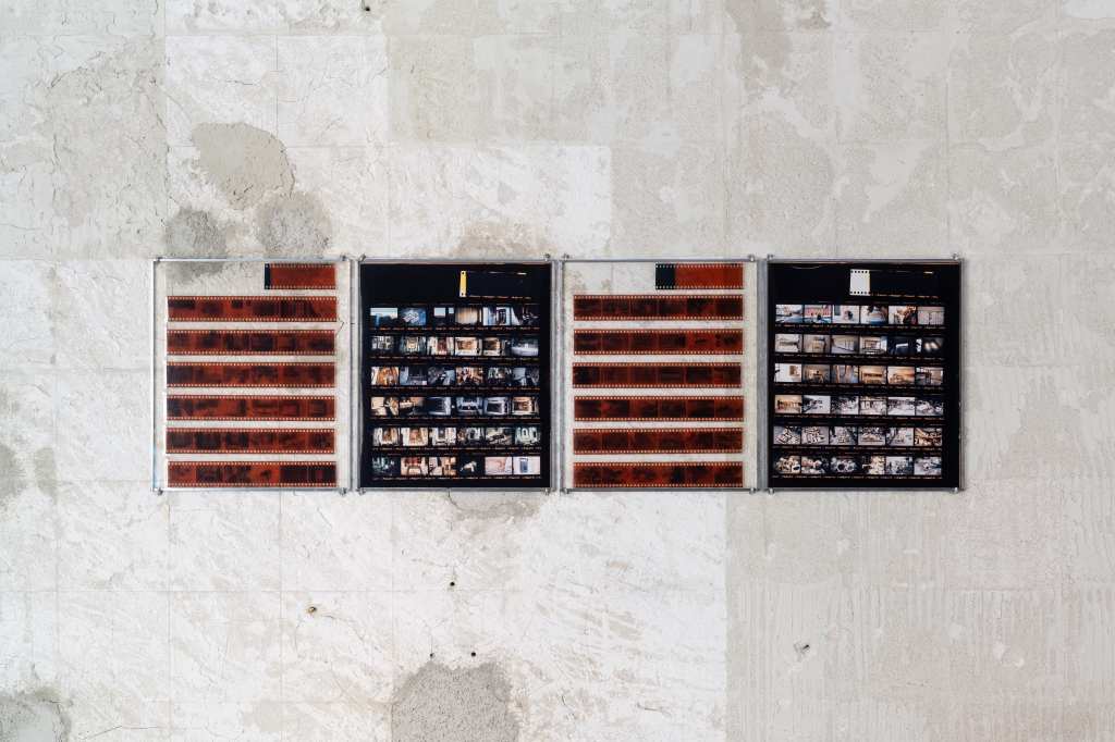 324 Photos: Hundreds of small photographs arranged in a dense grid, documenting locations across Venice and nearby islands, creating a visual archive of places and everyday scenes