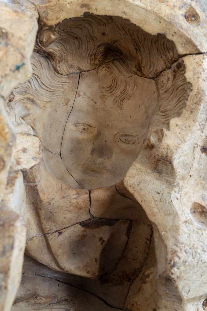 Angel: Close-up detail of the artwork, focusing on its material surface, texture, and sculptural form