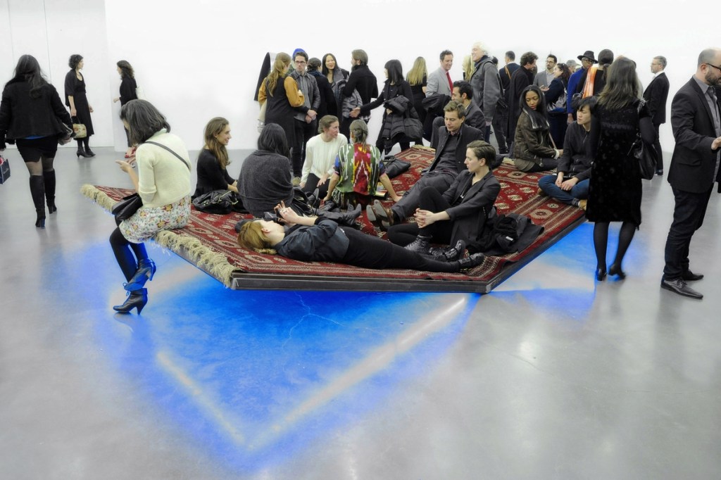 Installation view of Slavs and Tatars’ PrayWay, 2012, a large carpet-based installation incorporating silk, wool, MDF, steel and neon light at the New Museum, New York