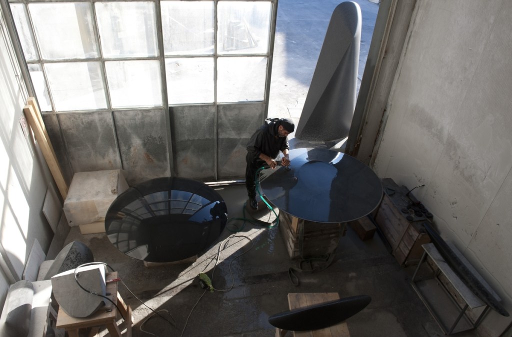 Armen Agop in his studio, surrounded by his sculptures. Photo by Patricia Franceschetti.